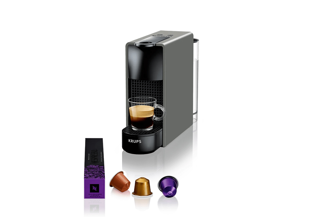 Απεικονίζεται η μηχανή μαζί με κάψουλες.